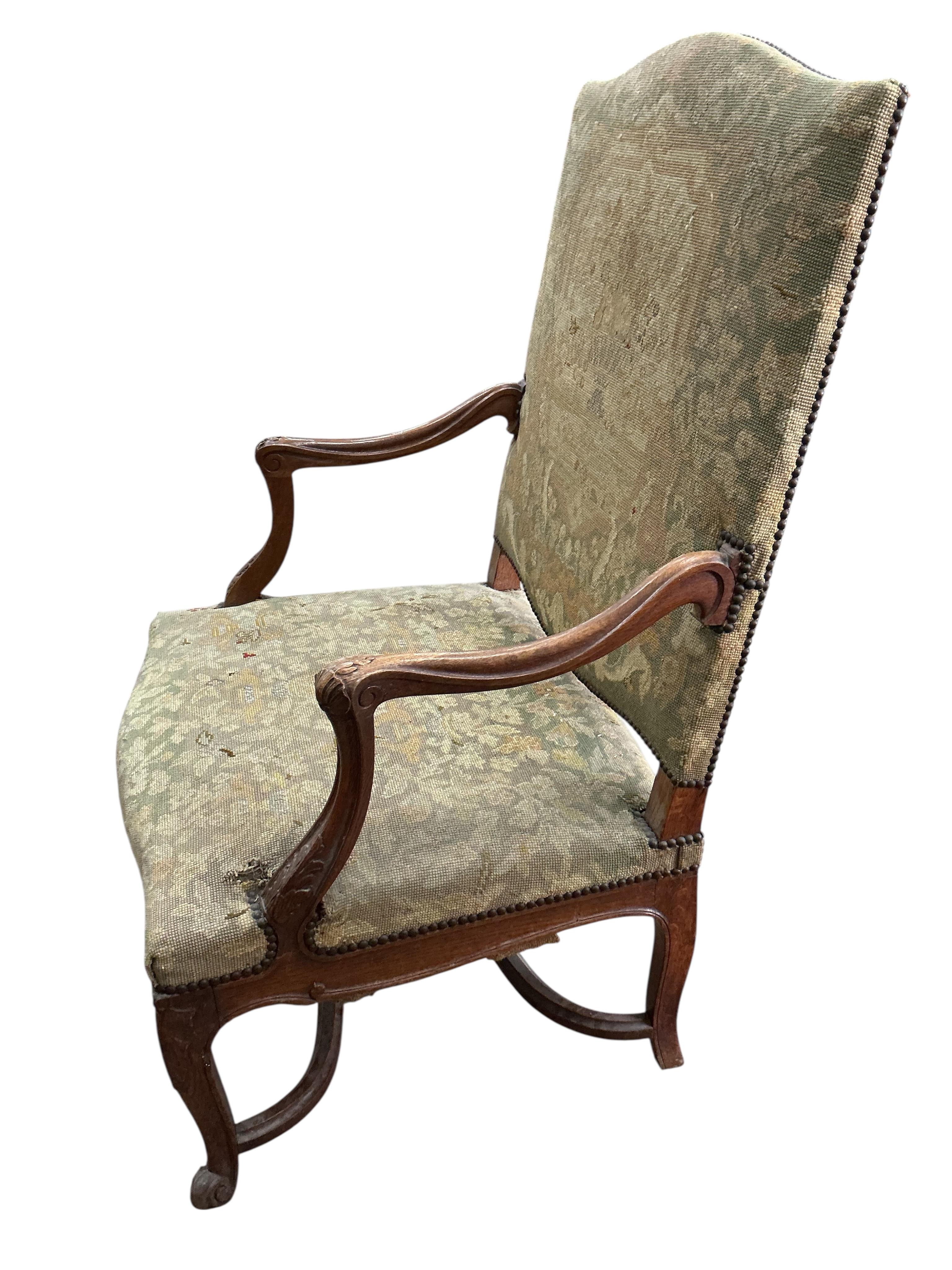 A Louis XV style oak grand fauteuil, width 79cm, depth 66cm, height 113cm, Provenance: The late Kenneth Turner (1936-2025), celebrity florist, designer and perfume retailer, he received the Royal Warrant from the Prince